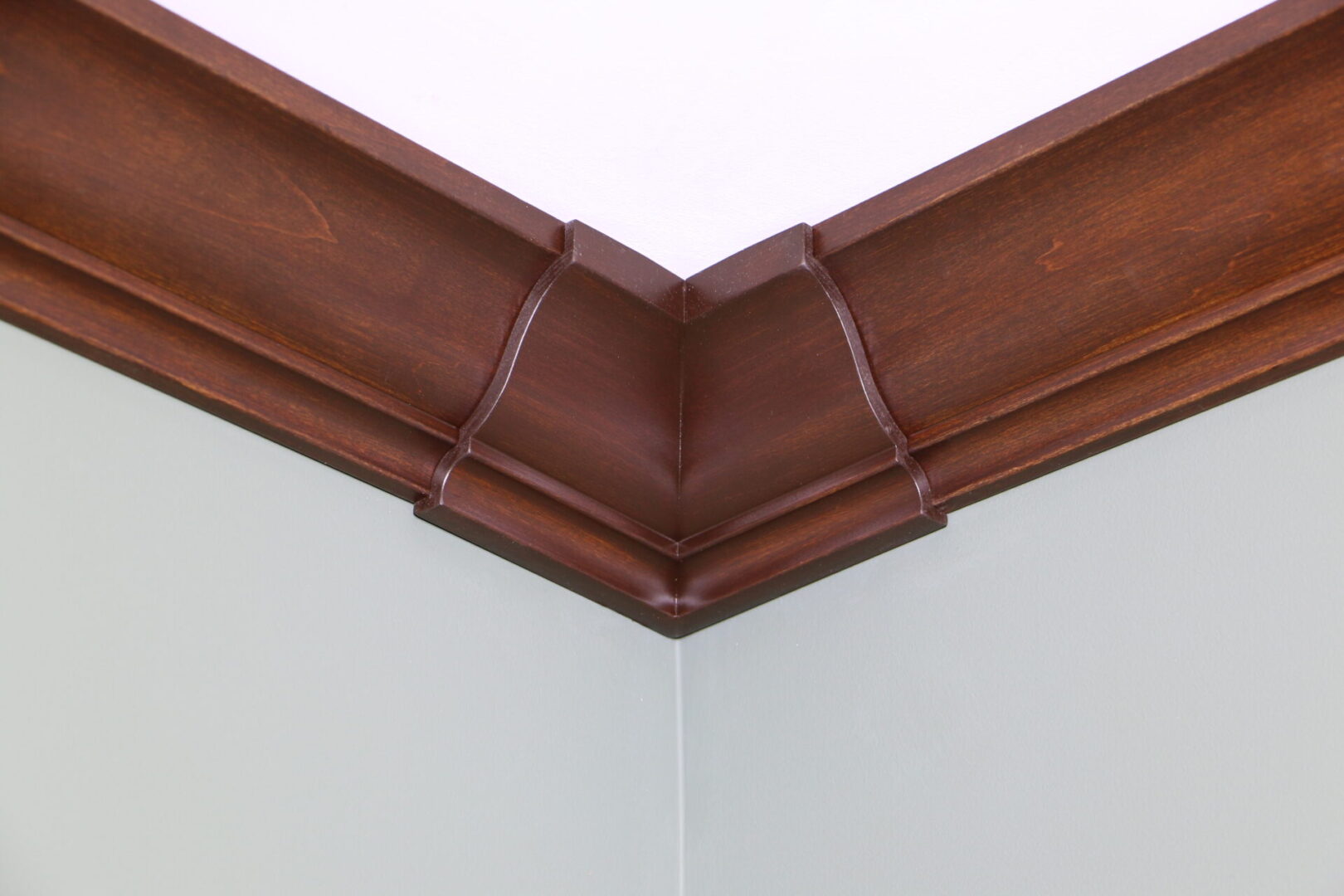 A corner of a room with wood trim.